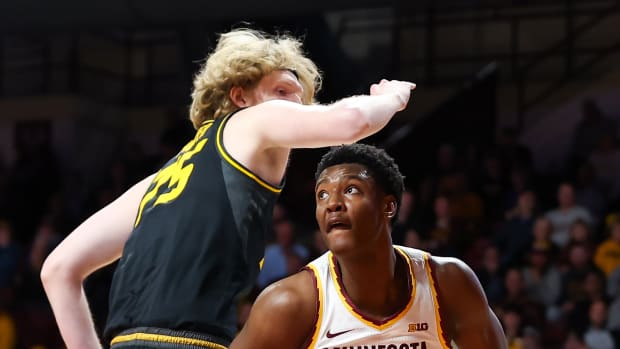 Minnesota Golden Gophers forward Pharrel Payne (21) drives as Missouri Tigers center Connor Vanover (75) defends during the first half at Williams Arena.=