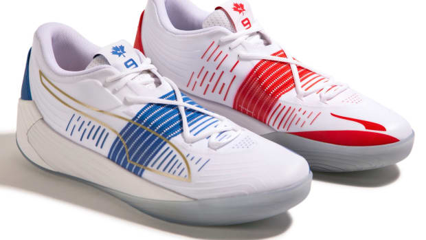 View of white, white, and blue Puma Fusion Nitro shoes.