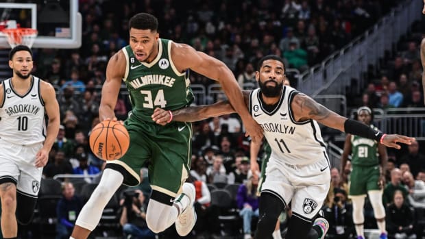 Milwaukee Bucks forward Giannis Antetokounmpo (34) drives to the basket against Brooklyn Nets guard Kyrie Irving (11)