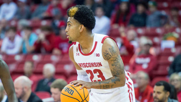Wisconsin point guard Chucky Hepburn dribbling the basketball in an exhibition game.