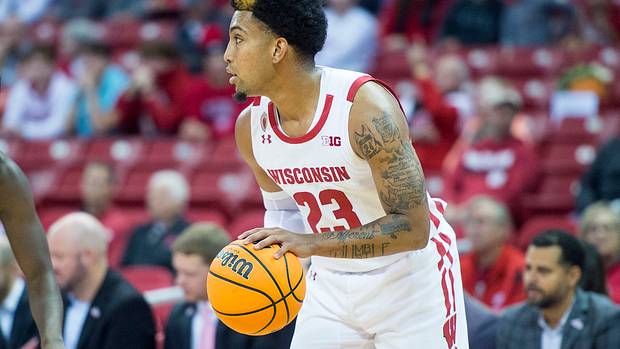 Wisconsin point guard Chucky Hepburn dribbling the basketball in an exhibition game.