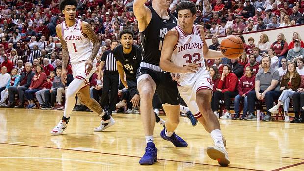 Indiana Hoosiers guard Trey Galloway (32) dribbles against North Alabama Lions center Eoin Nelson (15) defends in the first half at Simon Skjodt Assembly Hall.