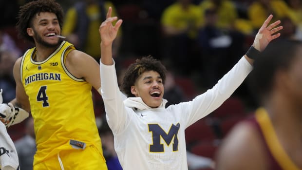 Michigan's Jordan Poole and Isaiah Livers (4) watch the final seconds of the 76-49 win against Minnesota in the Big Ten tournament semifinal Saturday, March 16, 2019 at the United Center in Chicago.