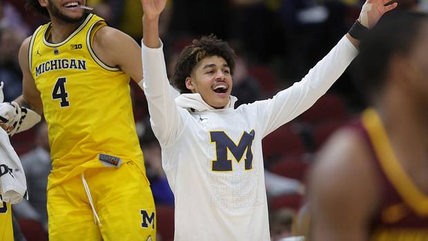 Michigan's Jordan Poole and Isaiah Livers (4) watch the final seconds of the 76-49 win against Minnesota in the Big Ten tournament semifinal Saturday, March 16, 2019 at the United Center in Chicago.