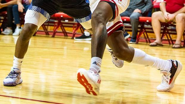 Indiana's Xavier Johnson (0) drives past St. Francis' Antwaan Cushingberry (12) during the Indiana versus St. Francis men's basketball game at Simon Skjodt Assembly Hall on Thursday, Nov. 3, 2022.