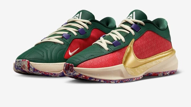 Side view of Giannis Antetokounmpo's red, green, and gold Nike shoes.