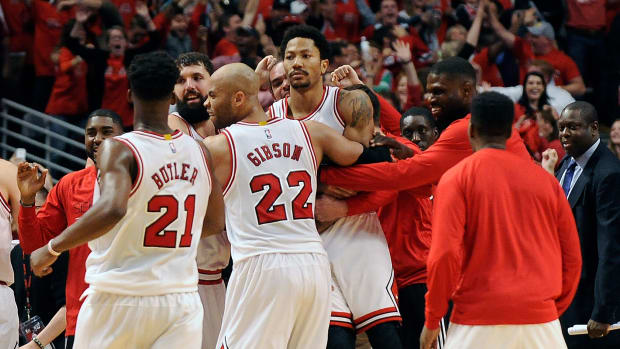 May 8, 2015; Chicago, IL, USA; Chicago Bulls guard Derrick Rose is lifted up by his teammates after hitting the game winning shot against the Cleveland Cavaliers during game three of the second round of the NBA Playoffs. at the United Center. The Chicago Bulls defeated the Cleveland Cavaliers 99-96.