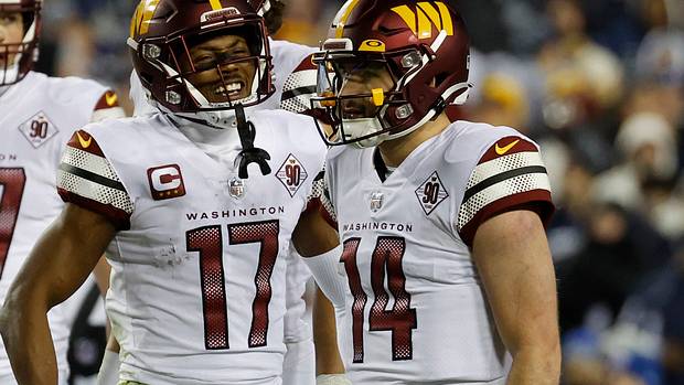 Washington Commanders quarterback Sam Howell (14) and receiver Terry McLaurin (17) celebrate a play in Week 18.