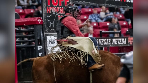 UNLV head football coach Barry Odom rides a live bull in an effort to raise funds and attention for the Rebels program.