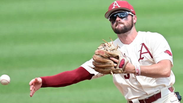 Arkansas shortstop John Bolton spent Monday, June 12 working with young men on their baseball skills in camp with no trip to Omaha looming.