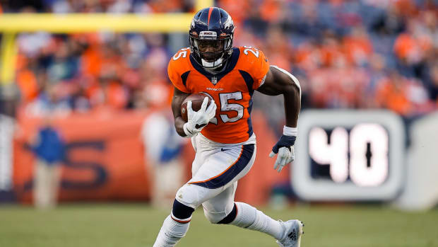 Denver Broncos running back Melvin Gordon III (25) runs the ball in the third quarter against the Detroit Lions at Empower Field at Mile High.