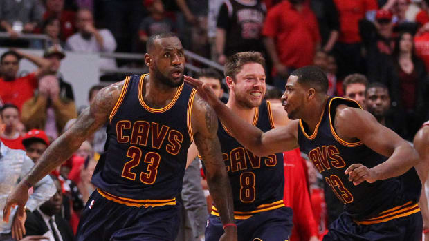 May 10, 2015; Chicago, IL, USA; Cleveland Cavaliers forward LeBron James (23) celebrates with teammates after scoring the game winning basket in the second half of game four of the second round of the NBA Playoffs against the Chicago Bulls at the United Center. The Cavaliers won 86-84.