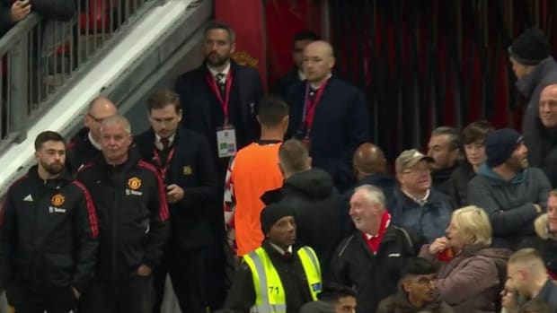 Cristiano Ronaldo pictured in an orange bib walking towards the tunnel at Old Trafford after refusing to come on as a sub during Manchester United's 2-0 win over Tottenham in October 2022