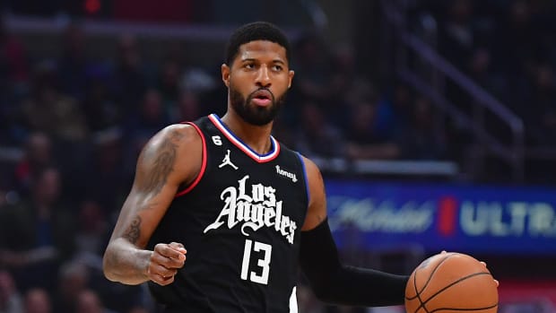 Clippers guard Paul George dribbles the ball.