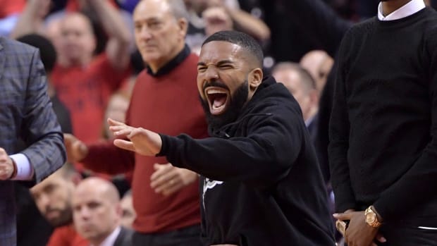 Drake cheers during a game.