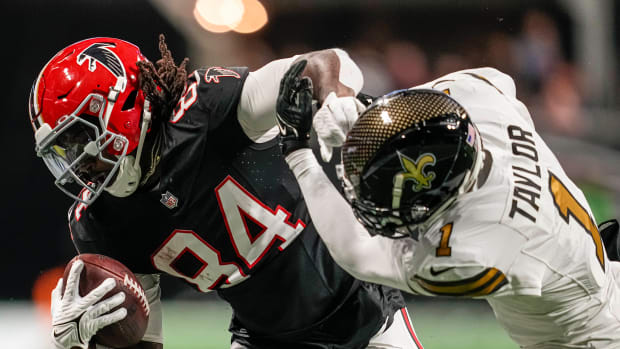 Atlanta Falcons running back Cordarrelle Patterson stiff-arms New Orleans Saints cornerback Alontae Taylor.