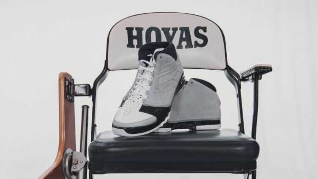 Grey and navy Air Jordan sneakers on a Georgetown Hoyas chair.
