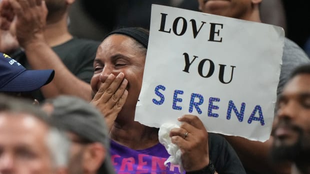 A fan watches Serena Williams during the first round of the 2022 U.S. Open