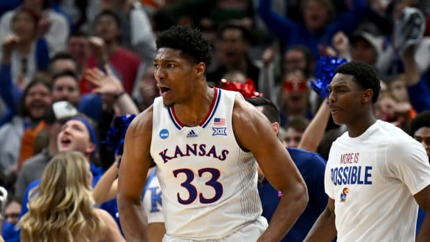 Mar 27, 2022; Chicago, IL, USA; Kansas Jayhawks forward David McCormack (33) celebrates after a play during the second half against the Miami Hurricanes in the finals of the Midwest regional of the men's college basketball NCAA Tournament at United Center. Mandatory Credit: Jamie Sabau-USA TODAY Sports