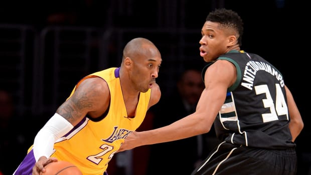 Milwaukee Bucks forward Giannis Antetokounmpo (34) defends Los Angeles Lakers forward Kobe Bryant (24)