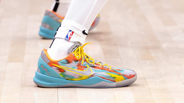 Side view of Kobe Bryant's blue and orange Nike sneakers.