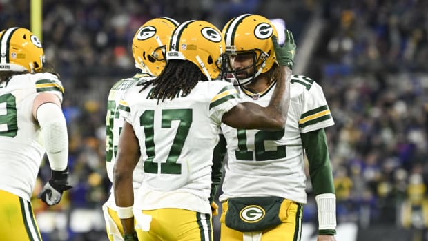 Green Bay Packers wide receiver Davante Adams (17) celebrates with quarterback Aaron Rodgers (12) after scoring a second quarter touchdown against the Baltimore Ravens at M&T Bank Stadium.