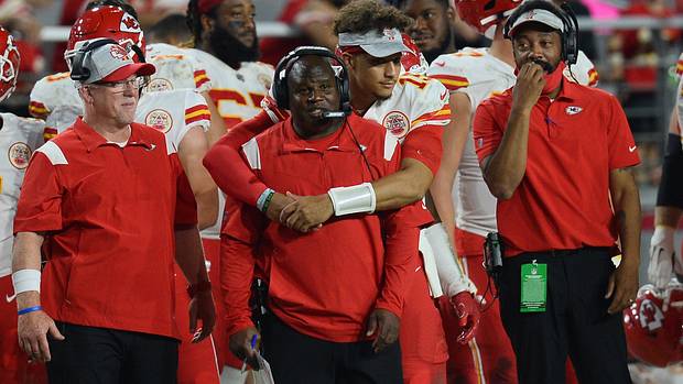 Kansas City Chiefs offensive coordinator Eric Bieniemy embraced by quarterback Patrick Mahomes.
