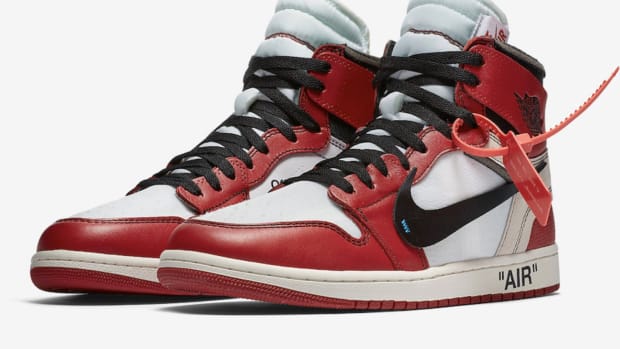 Side view of red, white, and black Air Jordan sneakers.