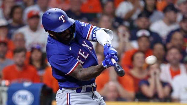 Oct 22, 2023; Houston, Texas, USA; Texas Rangers right fielder Adolis Garcia (53) hits a grand slam against the Houston Astros in the ninth inning during game six of the ALCS for the 2023 MLB playoffs at Minute Maid Park. Mandatory Credit: Troy Taormina-USA TODAY Sports  