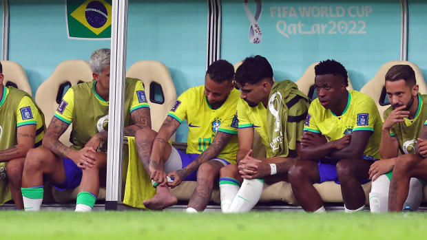 Neymar pictured applying pressure to his right ankle after being substituted off during Brazil's 2-0 win over Serbia at the 2022 World Cup in Qatar