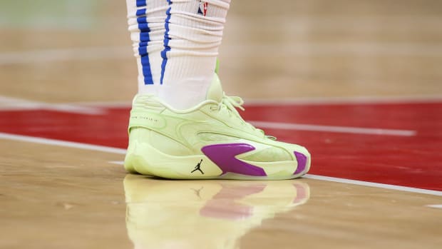 Dallas Mavericks guard Luka Doncic's green and purple Jordan Brand sneakers.