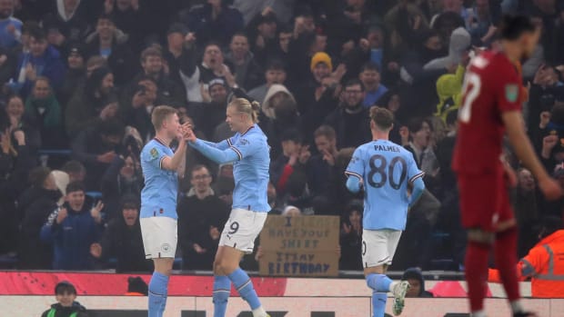 Erling Haaland (center) pictured celebrating with Kevin De Bruyne (left) after scoring for Manchester City against Liverpool in the EFL Cup fourth round in December 2022