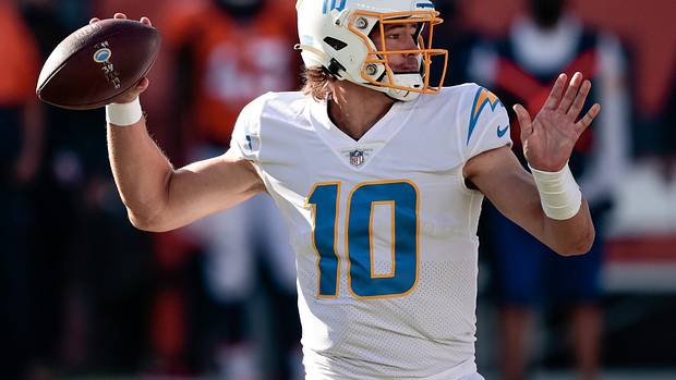 Los Angeles Chargers quarterback Justin Herbert (10) looks to pass in the first quarter against the Denver Broncos at Empower Field at Mile High.