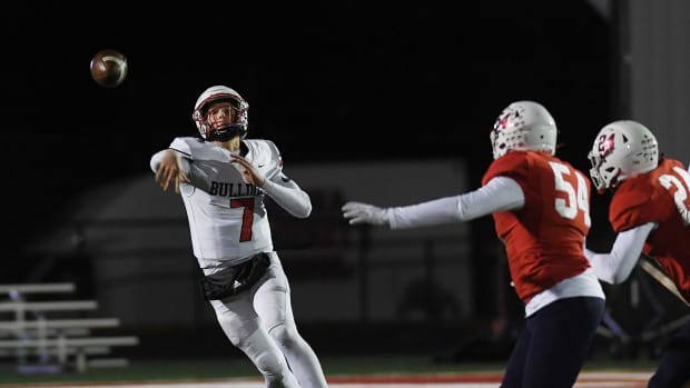Algona High School quarterback Alex Manske throwing the football in a game against Ballard.
