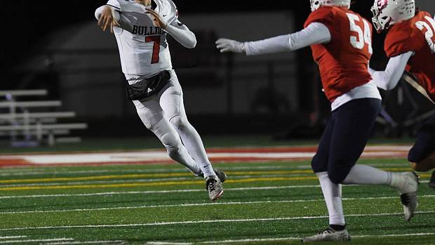 Algona High School quarterback Alex Manske throwing the football in a game against Ballard.