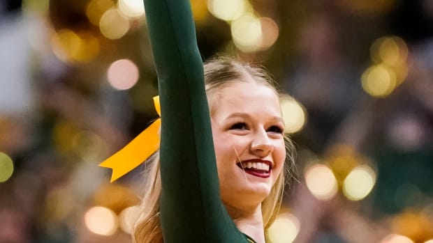 Feb 13, 2023; Waco, Texas, USA; A Baylor Bear cheerleader on the court during a timeout in the second half against the West Virginia Mountaineers at Ferrell Center. Mandatory Credit: Raymond Carlin III-USA TODAY Sports
