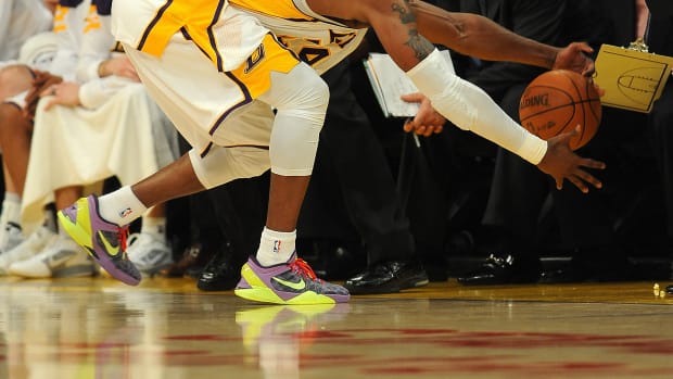 Los Angeles Lakers shooting guard Kobe Bryant reaches for a loose ball.