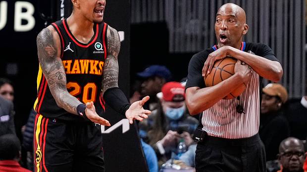 John Collins argues with an official.