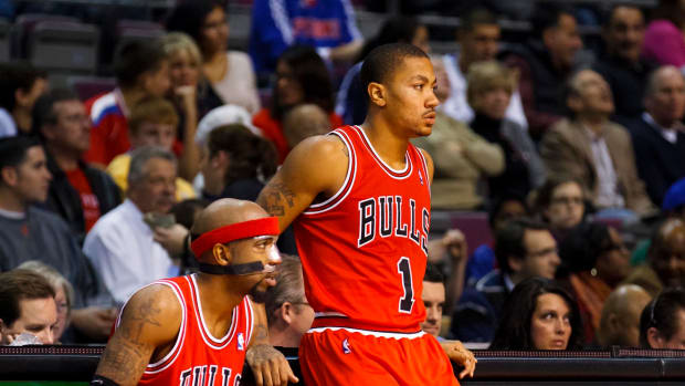 Jan. 4, 2012; Chicago Bulls shooting guard Richard Hamilton (32) and point guard Derrick Rose (1) wait to get into the game