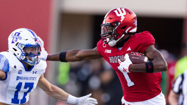 Indiana Hoosiers wide receiver Donaven McCulley (1) stiff arms Indiana State defensive back Maddix Blackwell (17) in the first half at Memorial Stadium.