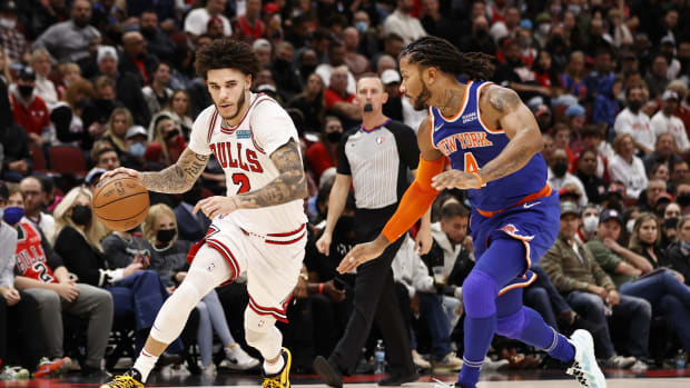 October 28, 2021; Chicago Bulls guard Lonzo Ball drives to the basket against New York Knicks guard Derrick Rose
