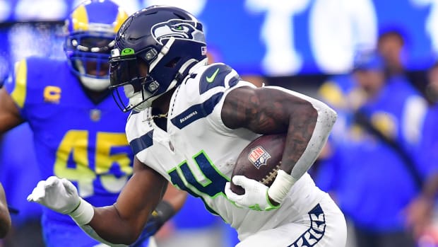 Seattle Seahawks wide receiver DK Metcalf (14) runs the ball against Los Angeles Rams linebacker Ernest Jones (53) during the first half at SoFi Stadium.