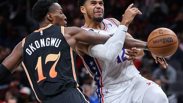 Hawks forward Onyeka Okongwu fouls 76ers forward Tobias Harris.