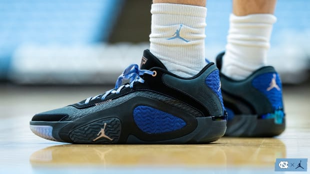 Side view of Jayson Tatum's black and blue Jordan Brand sneakers.