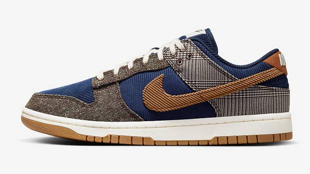 Side view of a blue and brown Nike sneaker.