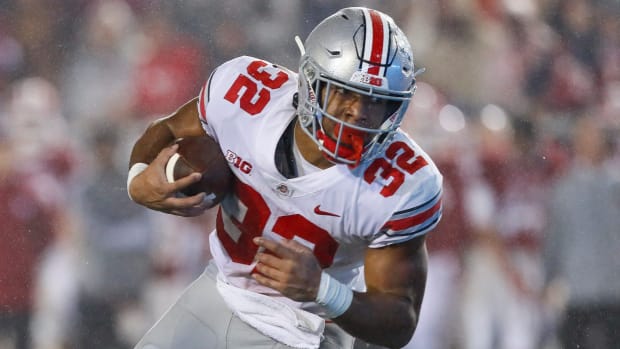 Ohio State Buckeyes running back TreVeyon Henderson on a run during a college football game in the Big Ten.