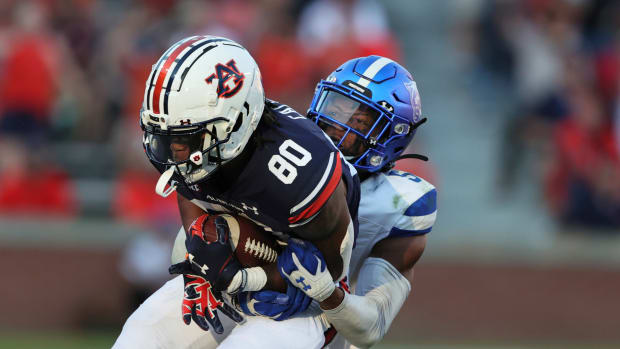 Auburn wide receiver Ze'Vian Capers (80) is tackled by Georgia State cornerback Bryquice Brown (5) after a reception during the second half of an NCAA college football game Saturday, Sept. 25, 2021, in Auburn, Ala.