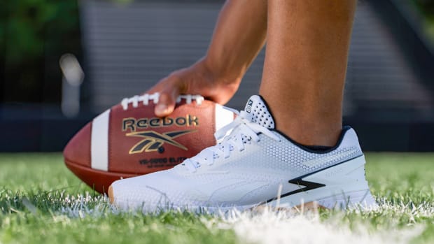 Side view of Justin Fields' white and black Reebok shoe.