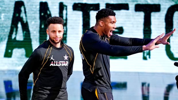 Team LeBron guard Stephen Curry of the Golden State Warriors (30) and Team LeBron forward Giannis Antetokounmpo of the Milwaukee Bucks (34) before the 2021 NBA All-Star Game
