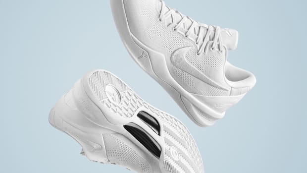 Side view of Kobe Bryant's white Nike basketball shoes.